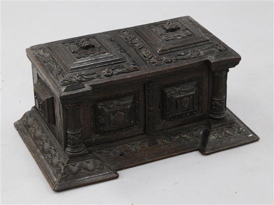 A miniature 17th century style Italian carved oak cassone, width 1ft 6in.